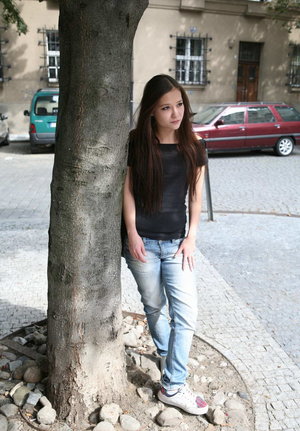 18 year old girl Agnes uncovers her perky tits as she gets completely naked